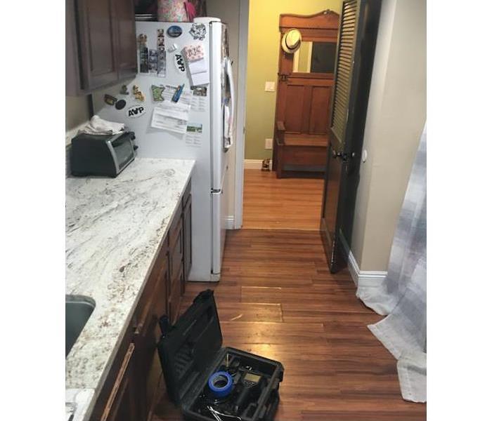 kitchen with hardwood damage 