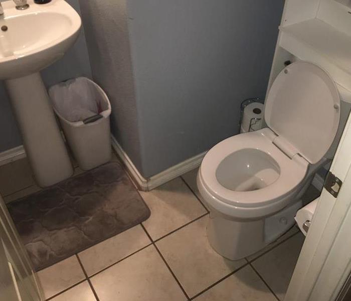 bathroom with wet flooring 