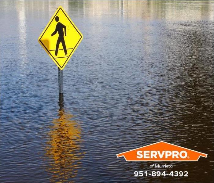 A street is entirely inundated by flood waters. 