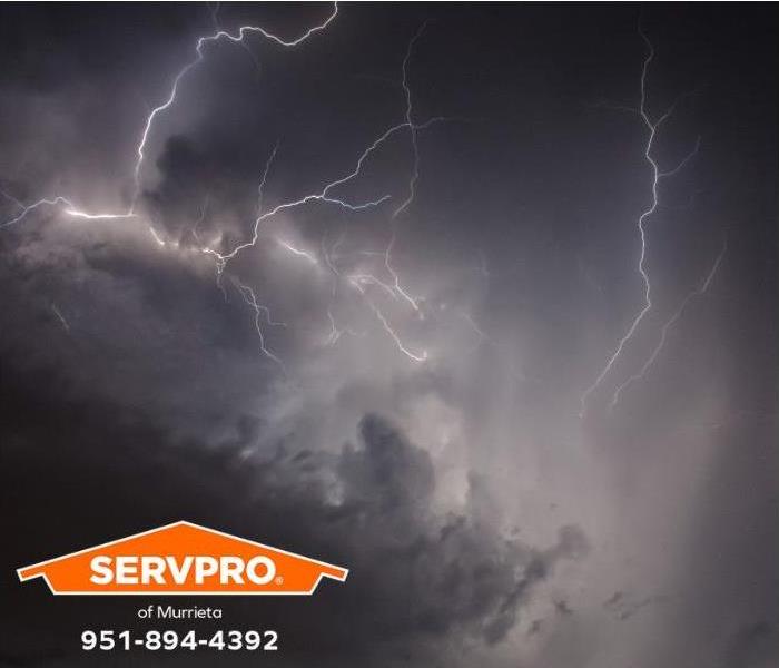 Lightning lights up the evening sky during a thunderstorm.