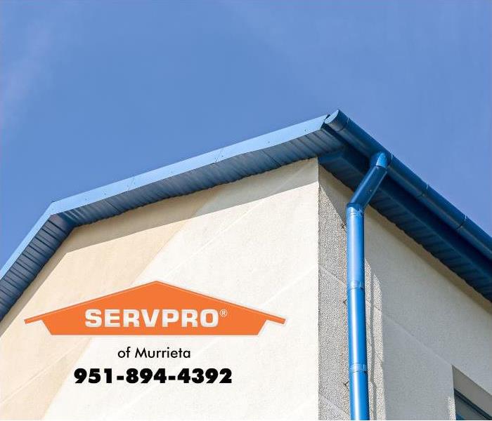 A home is shown with a rain gutter system.