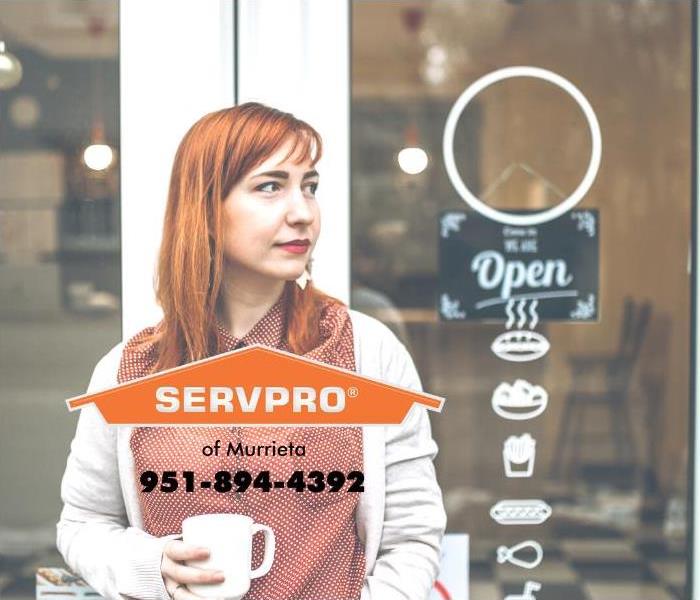 The front of a coffee shop is shown.