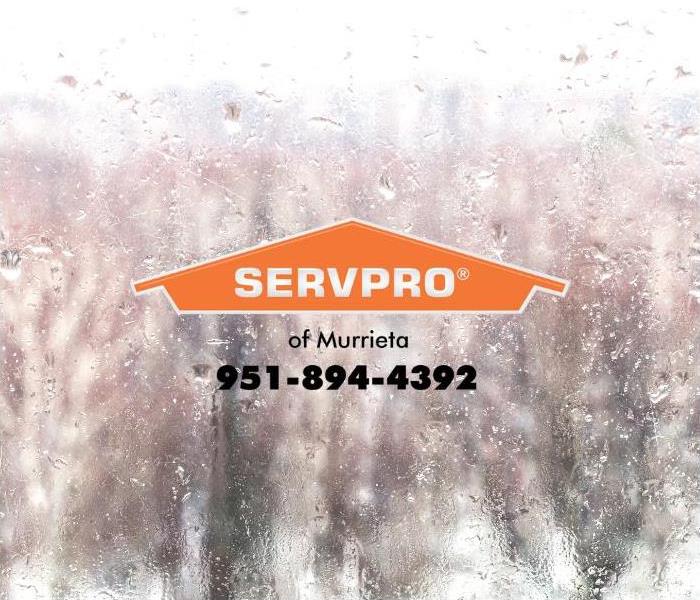 Water is dripping down a window.