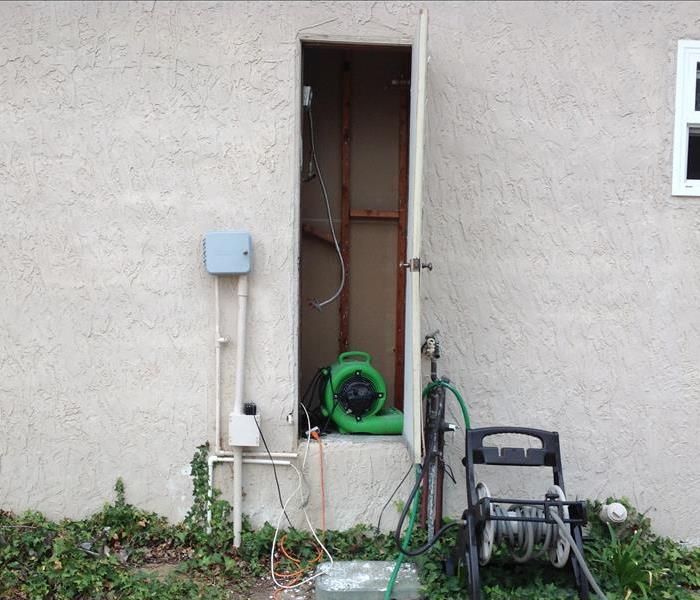 green equipment in utility room 