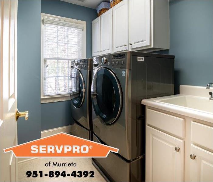 A clean and tidy laundry room is shown. 