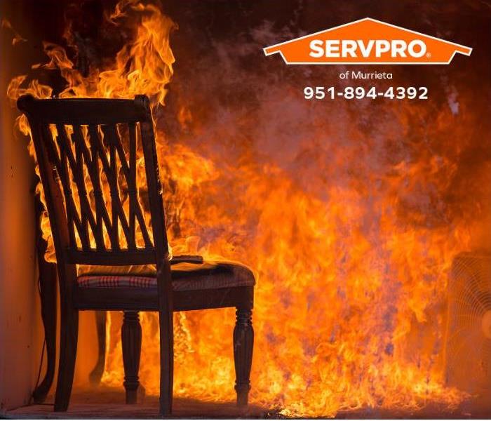 A dining room chair catches fire.